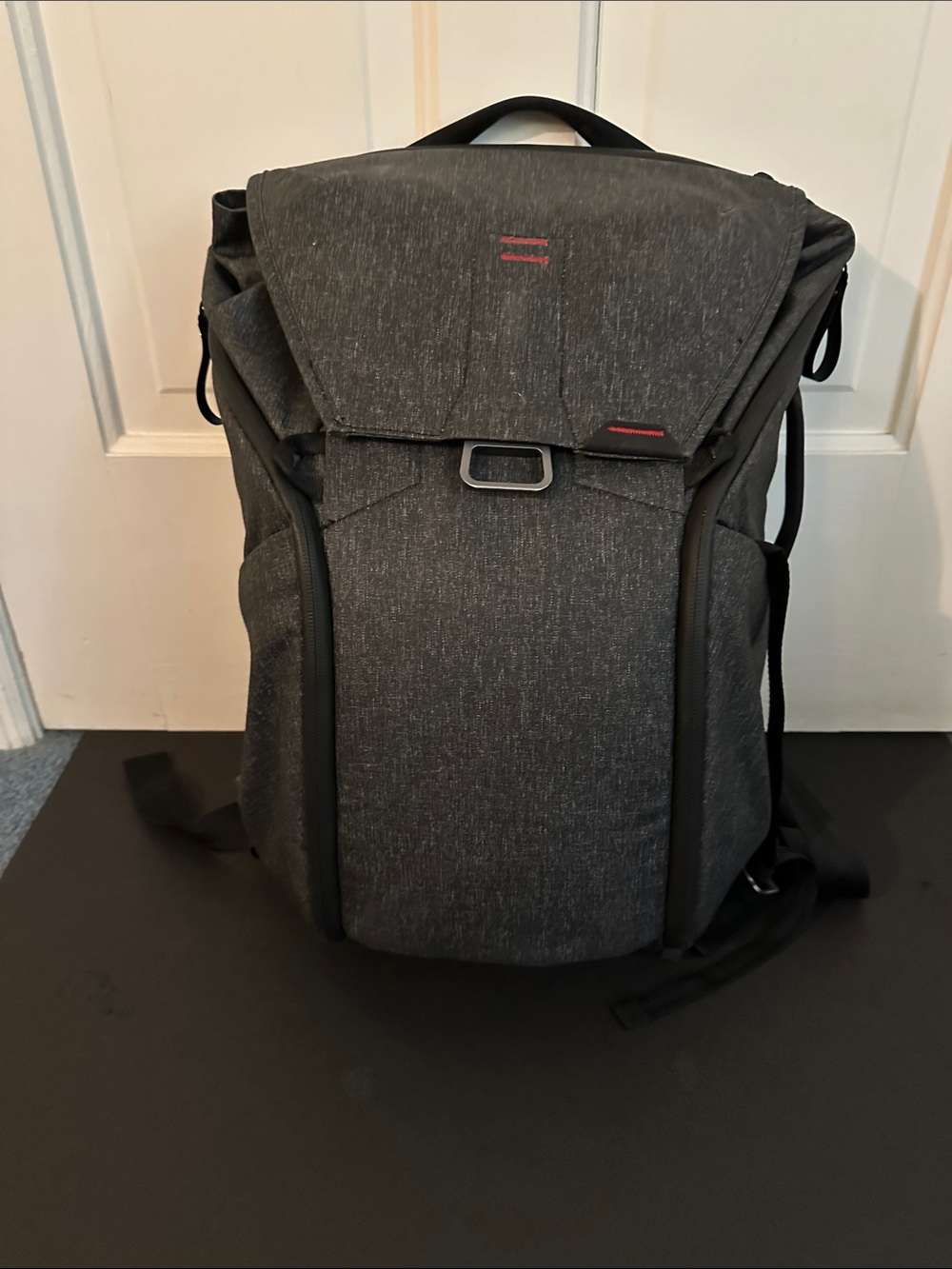 Peak Design Dark Gray Everyday Backpack with Red Accent.